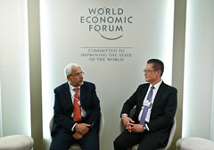 The Financial Secretary, Mr Paul Chan, arrived in Davos, Switzerland yesterday (January 19, Davos time) to attend the World Economic Forum Annual Meeting 2026. Photo shows Mr Chan (right) meeting with H.E. Dr Said Mohammed Al-Saqri (left), Minister of Economy of the Sultanate of Oman.